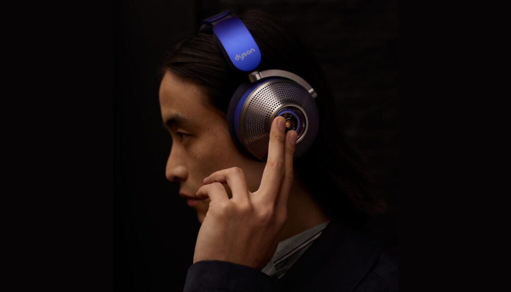 A person wearing the headset in a noisy environment, highlighting noise cancellation.